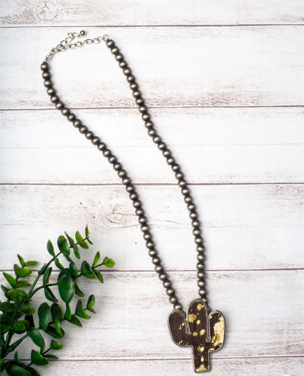 WANTED AND WILD BLACK COWHIDE CACTUS PENDANT ON NAVAJO PEARLS NECKLACE